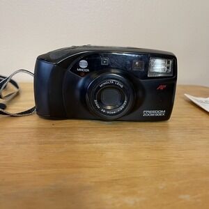 Camera. Minolta Freedom Zoom 90EX. 38-90mm. Minolta Lens 1:35-7.7 with Manual